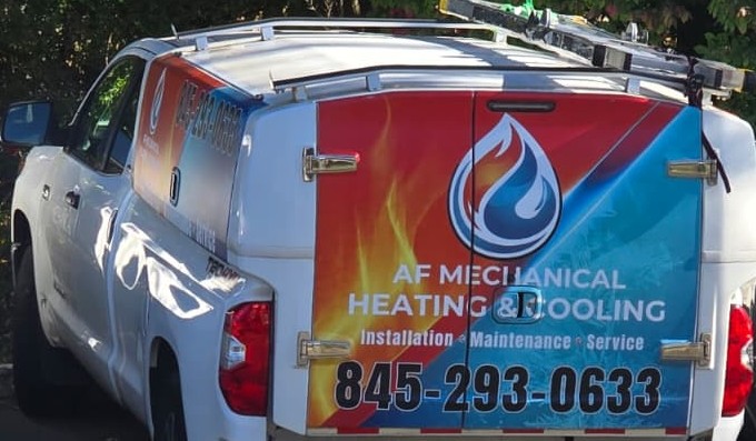 AF Mechanical work truck with company wrap and phone number
